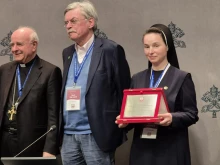 Sister Giustina Olha Holubets, SSMI, (far right) receives the “Guardian of Life” award from Archbishop Vincenzo Paglia of the Pontifical Academy for Life at a press conference in the Holy See Press Office on March 3, 2025.