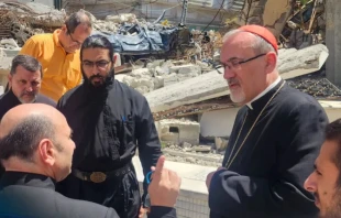 The Latin Patriarch of Jerusalem, Cardinal Pierbattista Pizzaballa speaks with Father Gabriel Romanelli, pastor of Holy Family Church, during his December 2024 visit to Gaza. Credit: Latin Patriarchate of Jerusalem