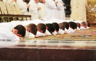 Ordinandi lie prostrate during the Litany of Saints during an ordination Mass in St. Peter’s Basilica on Sept. 29, 2016. Credit: Daniel Ibanez/CNA