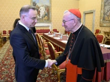Vatican Secretary of State Cardinal Pietro Parolin (right) meets with Polish President Andrzej Duda on March 28, 2025, at the Vatican. 