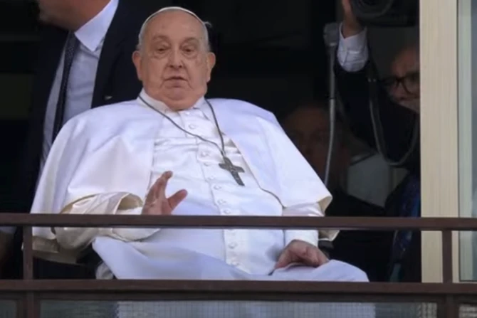 Pope Francis waves from a balcony at Gemelli Hospital in Rome on Sunday, March 23, 2025, following weeks of hospitalization for bilateral pneumonia.